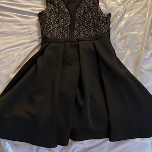 Black with gold detailing cocktail dress from Dynamite